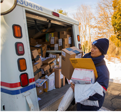 Letter Carrier delivering packages.