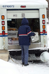 letter carrier in the snow