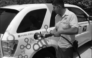Man fueling a fuel efficient car
