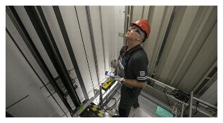 Image of a maintenance man in an elevator shaft