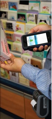 Retail associate using Mobile Point of Sales (mPOS) to scan a package.