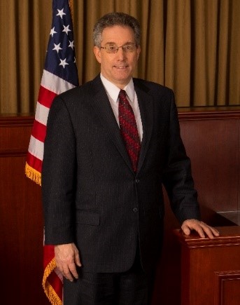 Acting Judicial Officer Alan Caramella