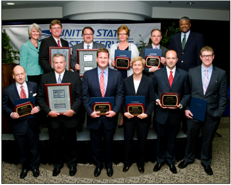 Back row (left to right): Susan M. Brownell, vice president, Supply Management, U.S. Postal Service; Randy Davies, president & chief operating officer, Wheeler Bros., Supplier Performance Award; Timothy Pals, president & CEO, Eagle Express Lines,Supplier Performance Award; Susan Rapp, director, EMCOR Customer Solutions Center, Supplier Excellence Award; Michael Jones, president, Carolina Cabinet Company, Supplier Sustainability Excellence Award; Ron Stroman, Deputy Postmaster General, U.S. Postal Service; Front row (left to right): Barry Scribner, managing director, Public Institutions, Jones Lang LaSalle, Supplier Innovation Award; Oded Barlev, vice president, National Operations, ABM Security Services, Supplier Performance Award; Rob Hale, president & CEO, Granite, Supplier Excellence Award; Mary Ann Hopkins, executive vice president, for Global Business Development, Parsons Corporation, Supplier Diversity Award; Scott Figiel, sales manager and Luke Bawel, general manager, Jasper Innovative Solutions, Supplier Excellence Award.