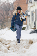 Letter carrier in the snow.