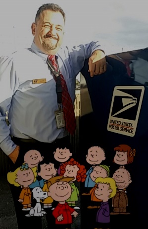 Tampa, FL, Postal Service Retail Associate Mark Cripps uses the USPS AR to snap a picture with Charlie Brown Tampa, FL, Postal Service Retail Associate Mark Cripps