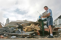 debris surrounds carrier delivering mail