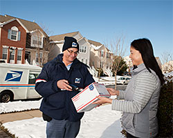 postal carrier delivering the mail