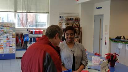 Manager Audrey Lakes talks with a customer about service concerns in Jamaica Plain Manager Audrey Lakes talks with a customer about service concerns in Jamaica Plain