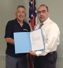 David Filosa of Milford (left) with the Postal Service by Postmaster Nicholas Tselikis David Filosa of Milford (left) with the Postal Service by Postmaster Nicholas Tselikis