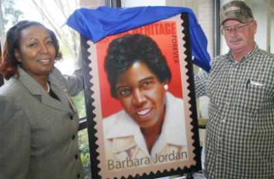 Postmaster Teresa Long (left) dedicates commemorative Forever stamp featuring Barbara Jordan, along with postal retiree Vernon Howard.