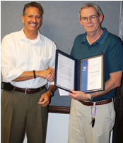 Greensboro District Mgr. Russell Gardner presents IS Specialist (A) John Marquis with AVP award. Greensboro District Mgr. Russell Gardner presents IS Specialist (A) John Marquis with AVP award.