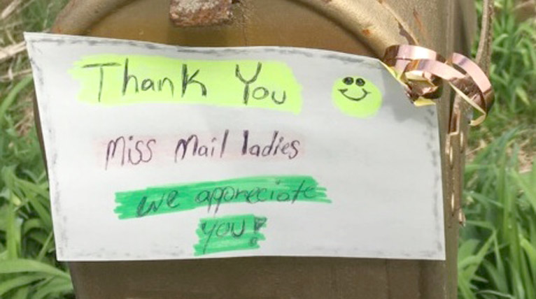 Mailbox with note, 'Thank you miss mail ladies, we appreciate you'