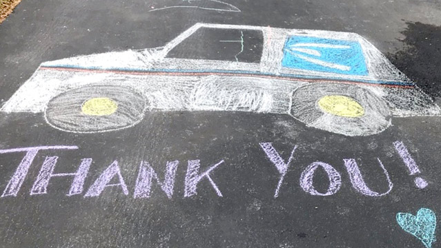 'Thank you' and Postal truck drawn with chalk