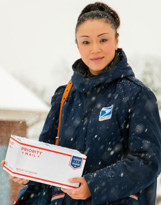 USPS Letter Carrier holding a package.