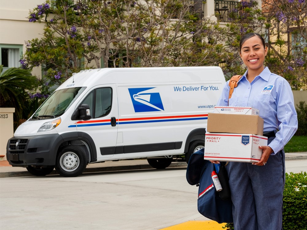 Postal Carrier holding packages
