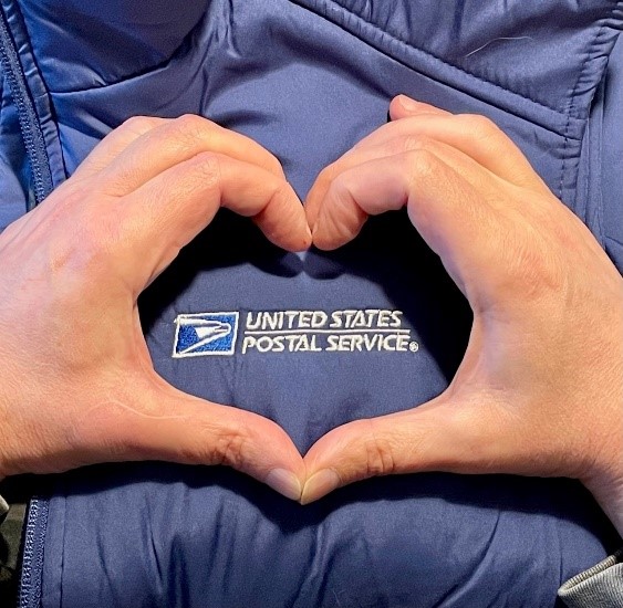 Postal Service uniform with a hand heart