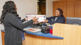 Retail Service Clerk attending a customer