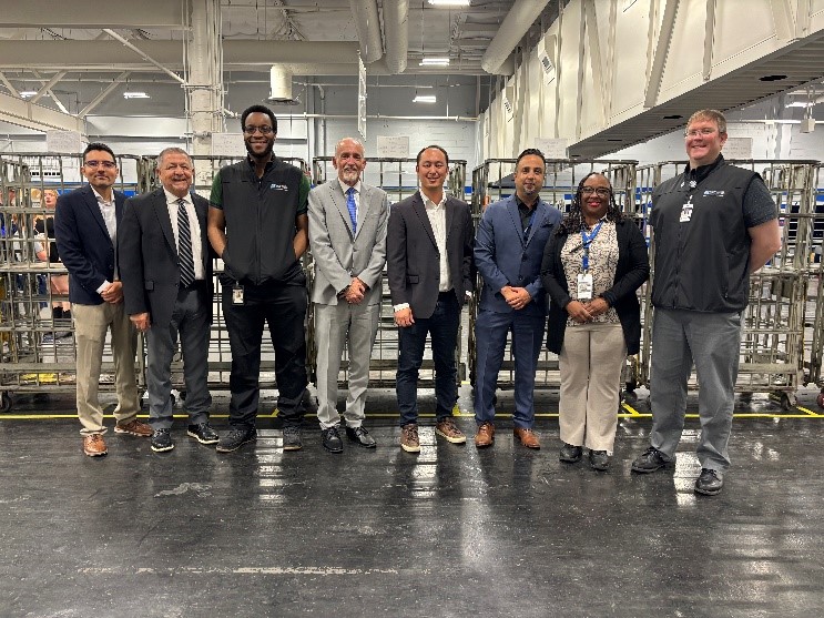 Letter Carrier delivering mail on route.