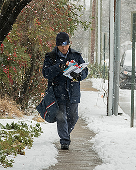 mailman delivering in snow