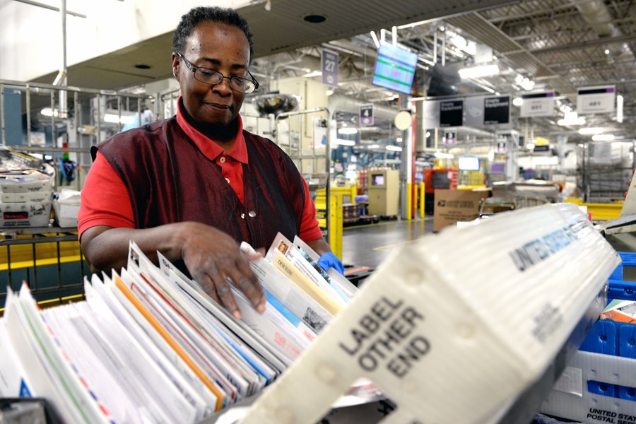 a woman mail sorting