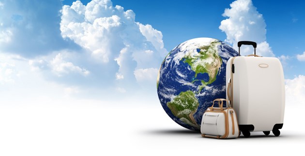 luggages beside the globe