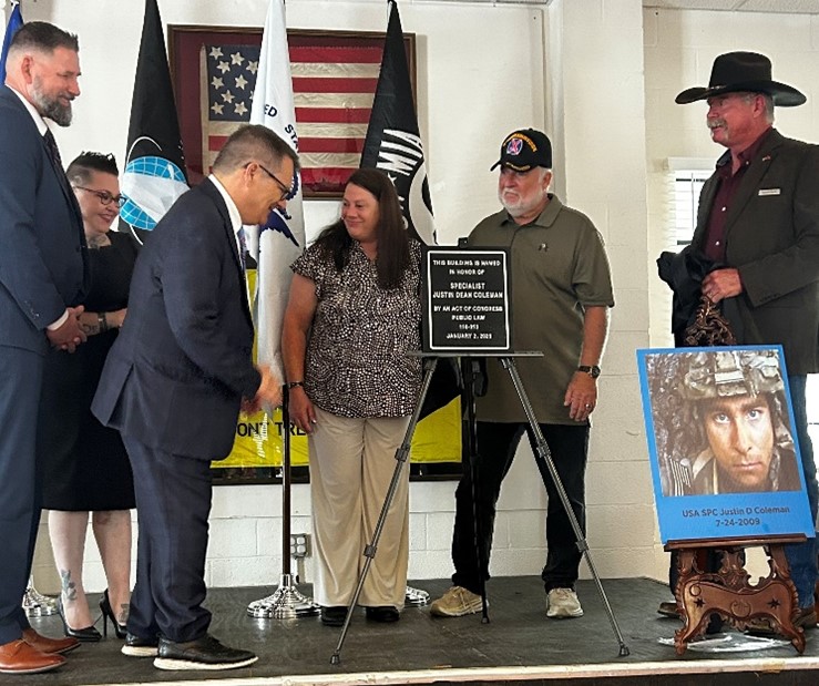 Photo (from left) Manager, Customer Relations Robert Gaskin; U.S. Army Veteran Sheila Jean Moss; Representative Gus Bilirakis; Mrs. and Mr. Coleman; and U.S. Marine Veteran/dedication emcee Eric Ryan Anderson.