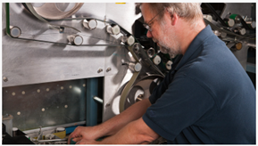 USPS Technician working on equipment