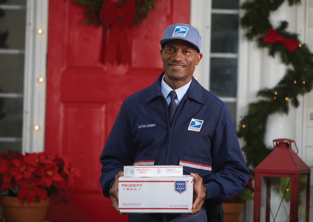 Mail Carrier holding packages