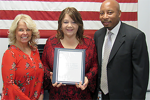 Belfry Postmaster Kathy Howard, Contract Driver Jacqueline Goff, and Kentucky-West Virginia District Human Resources Manager Mark Harvey