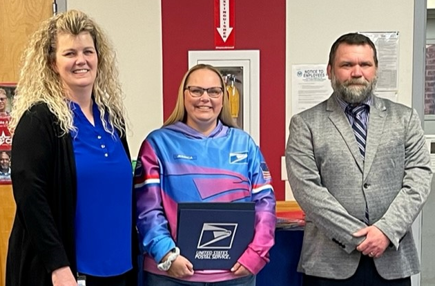 Gilbertsville Postmaster Serita Head, Rural Carrier Jessica Repovich and Manager, Post Office Operations Samuel Kepple.