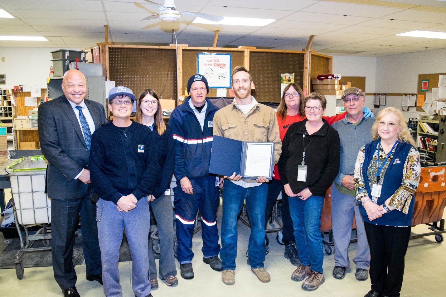 Zumbrota Rural Carrier Jared Sprenger with coworkers