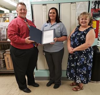 Clerk Lisa Oyler with Postmaster General Hero Award