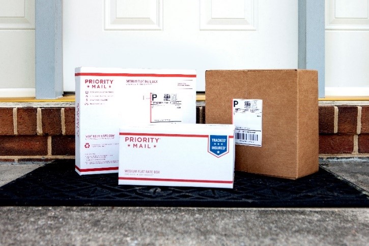 Three Priority Mail packages.