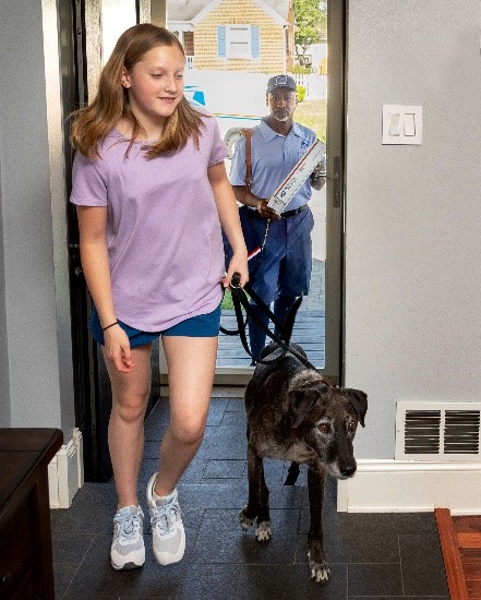 Girl leading a door from the an open door