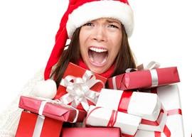 A girl holding holiday presents