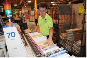 USPS Postal worker sorting mail