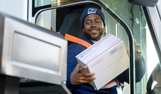 USPS Rural Carrier delivering a package