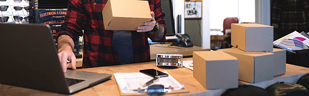 Tabletop with boxes and laptop