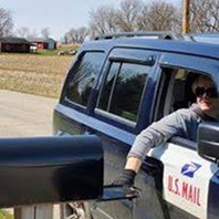 Rural Carrier delivering mail
