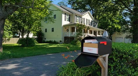 a mailbox at the front of house