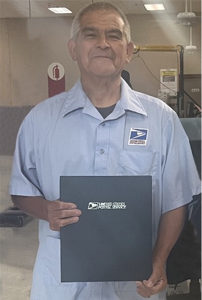 Waco, TX Letter Carrier Ryan Cook delivers mail in a new USPS Next Generation Delivery Vehicle