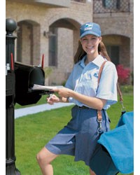 Mail Carrier standing next to a mailbox