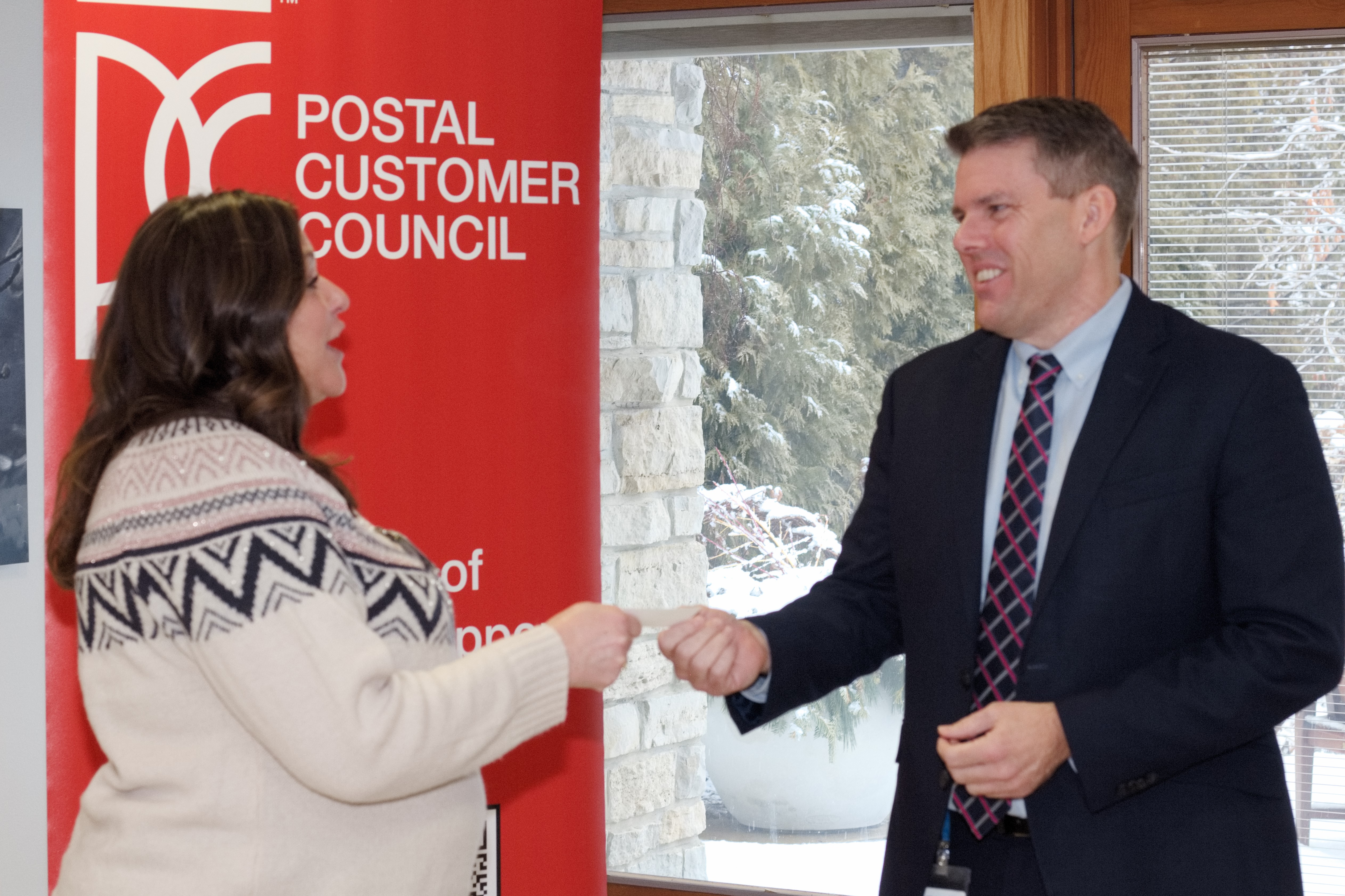 Kari Ripp-Rosenstie (l), Manager Postage and Print Products, Colony Brands IMS and U.S. Postal Service Wisconsin District Manager (A) Jeff Drake discussed postal products during the Greater Madison Area Postal Customer Council annual meeting.