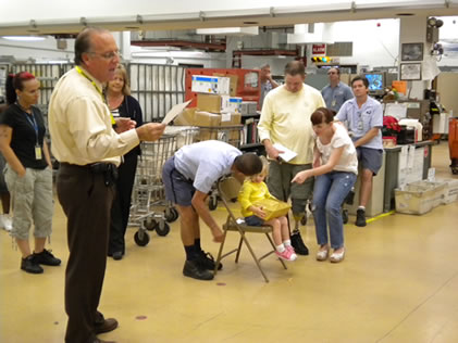 Chad Holland making a presentation on Defensive Driving to postal employees at the Naples Main Post Office