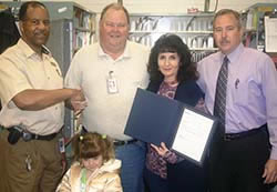 Postmaster Rockie Williams, Rural Carrier Robert B. Foster, daughter Hannah, wife Georgene and P.O. Operations Mgr. Robert Hall