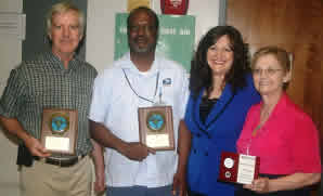 HONORED: At Reidsville Post Office (l-r), retired rural letter carrier Randy French, city letter carrier Alvino Wilson, Postmaster Karen Hodges and clerk Rose Creed celebrate excellence in safety for over 30 years.