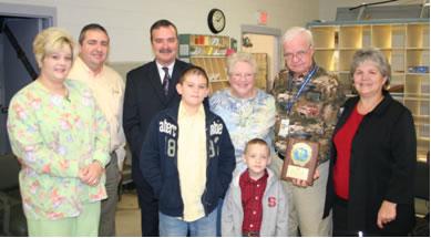 Clifton Kinlaw receives National Safety Council's Million Mile Award. In this picture, he is joined by his family and Mid-Carolinas District Manager David Fields