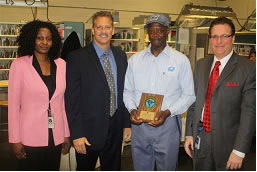 AND THE AWARD GOES TO: At Greensboro Summit Station, Bernard Smith (2nd from right) receives Million Mile award from (l-r) Station Mgr. Sharon Patrick, DM Russ Gardner and PM Ronnie White.