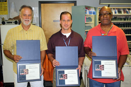 From left to right, rural carrier Joe Hopkins, Postmaster Michael Payne, and sales and service associate Kenneth Tatum, all from Browns Summit, were recognized for their excellence in customer service.