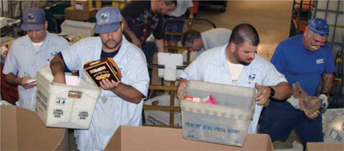 Postal workers sorting food drive donations